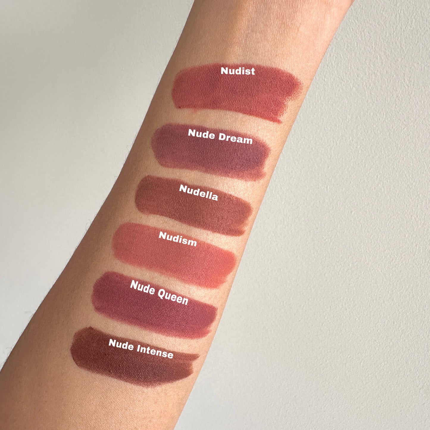 Soft blur matte Lipstick swatches on a person's arm with shade names. Best shades for Indian skin tones